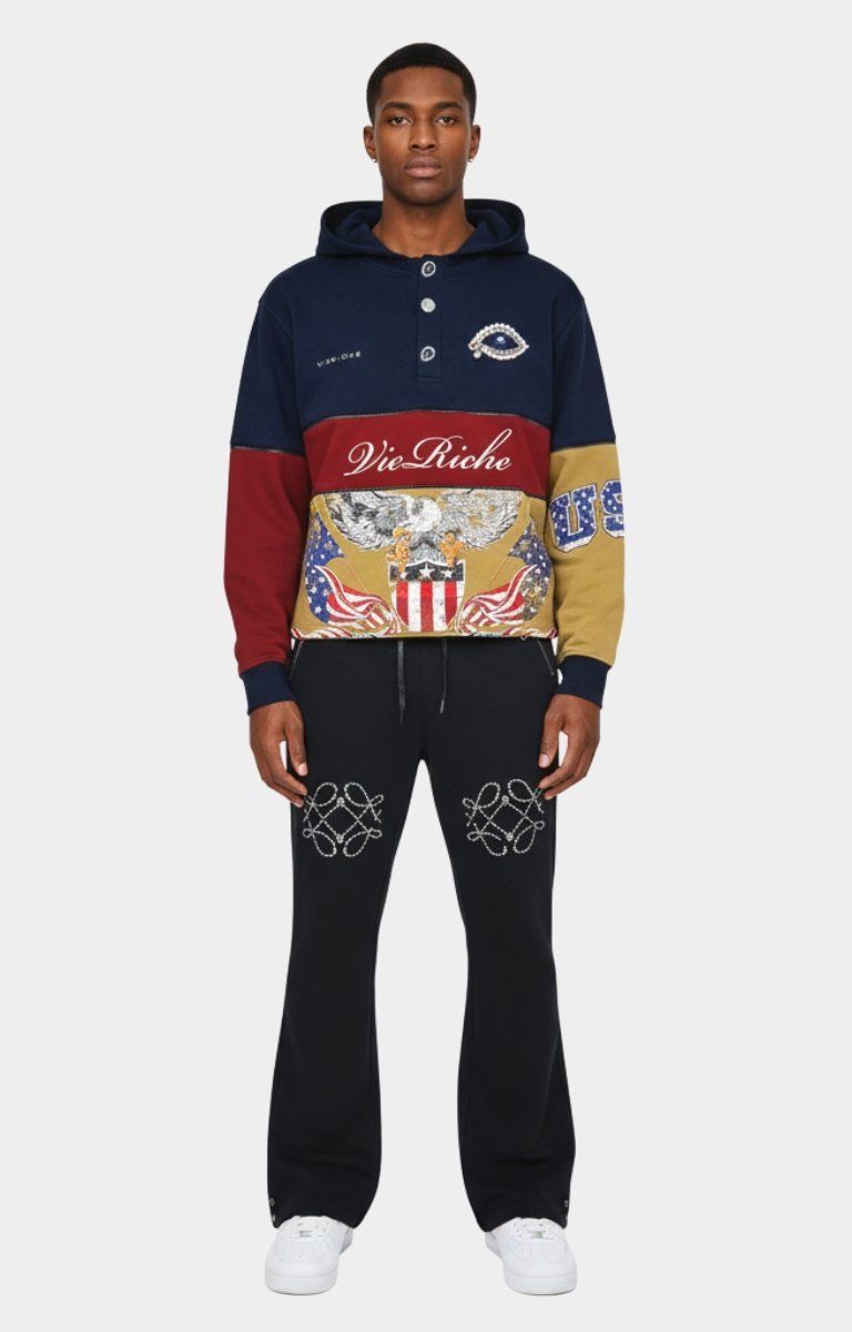 Evil eye motif brooch appliqué on Vie Riche hoodie.