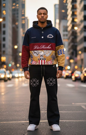 Decorative brooches at neckline on Vie Riche hoodie.