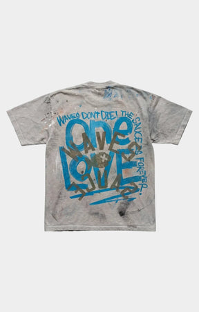 Waves x Sauce Bob Marley One Love Tee in Stone, made from 100% heavyweight cotton with vintage-washed construction, hand-painted and screen-printed artwork, distressed detailing, and a unique one-of-one finish.